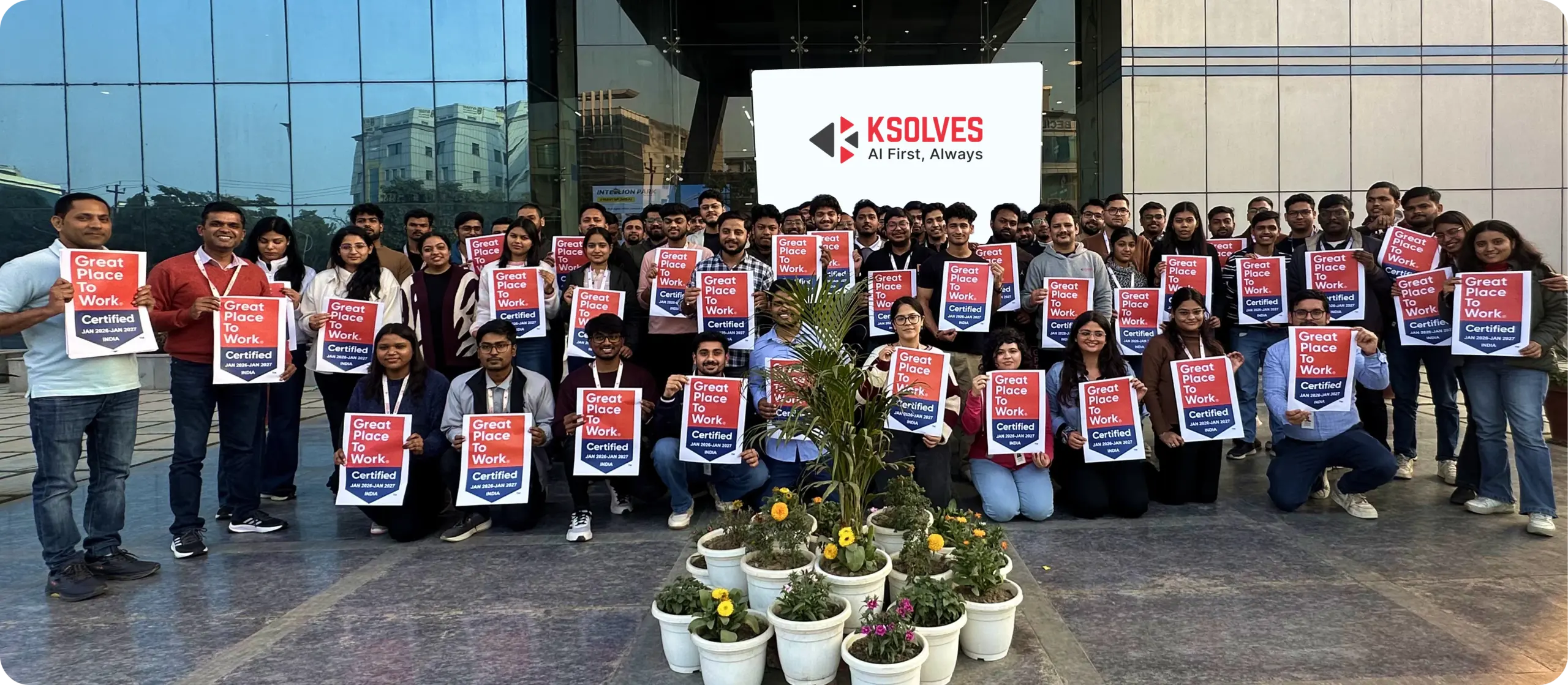 Ksolves team members holding Great Place to Work certificates at company headquarters