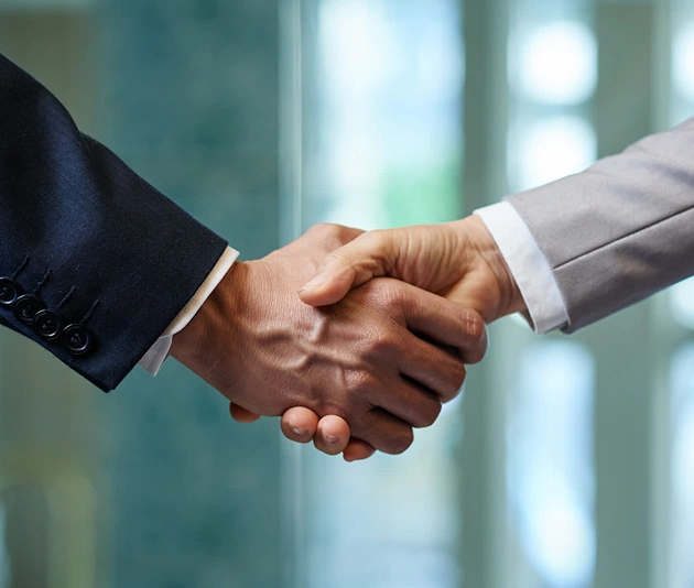 Business handshake representing trusted partnership